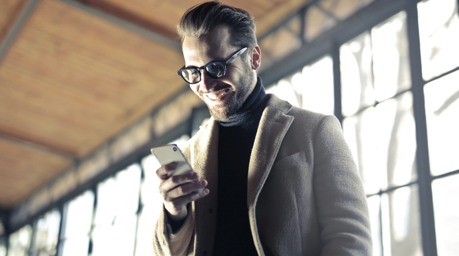 A person typing a message on a phone, illustrating a customer chatting with a Zalo chatbot