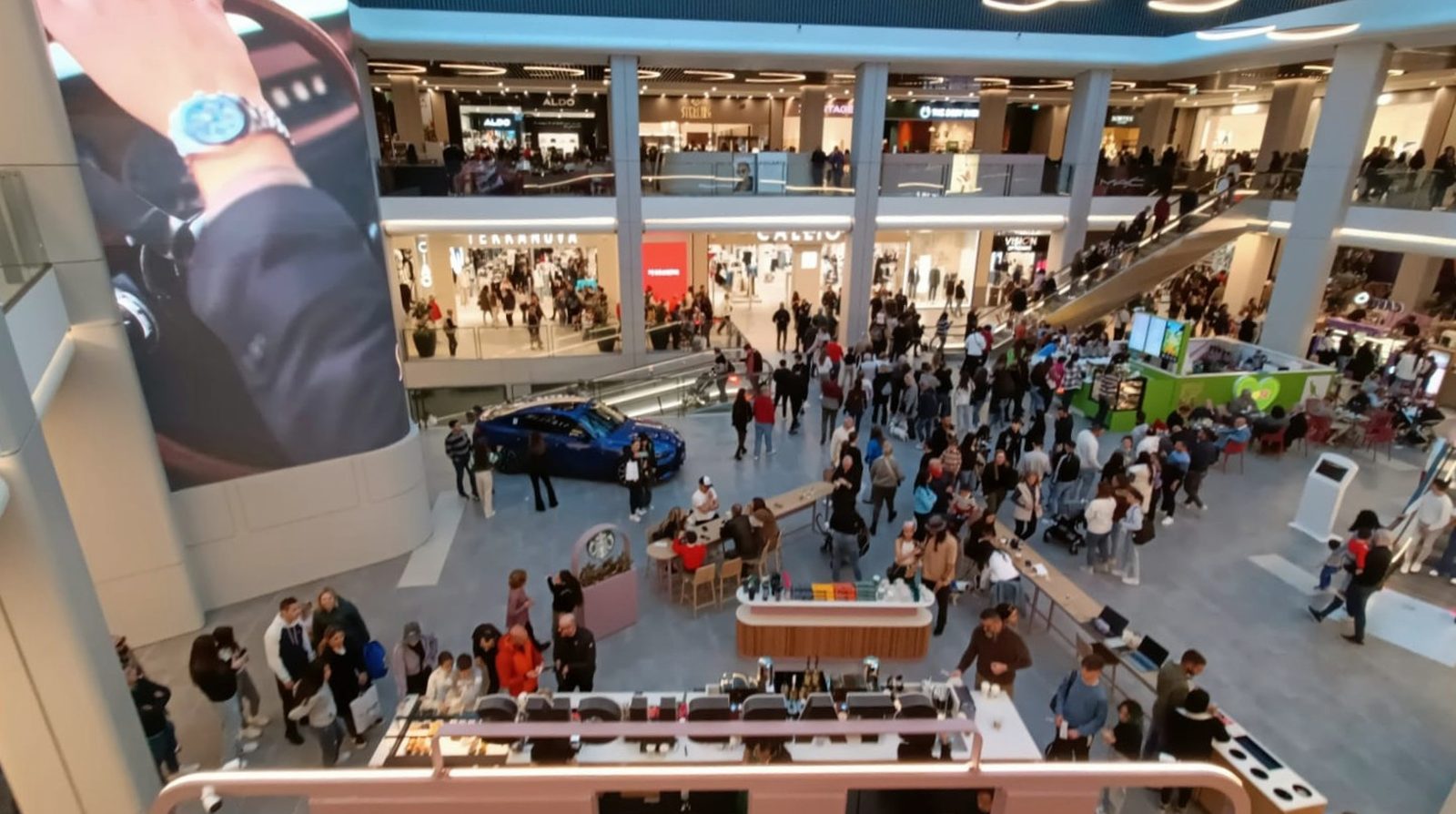 Inside a busy modern shopping mall